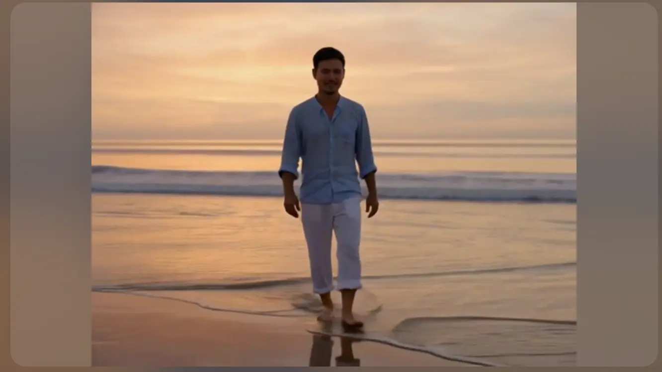PikaSwaps replaces a man's face in a beach walking video while preserving the original motion and background