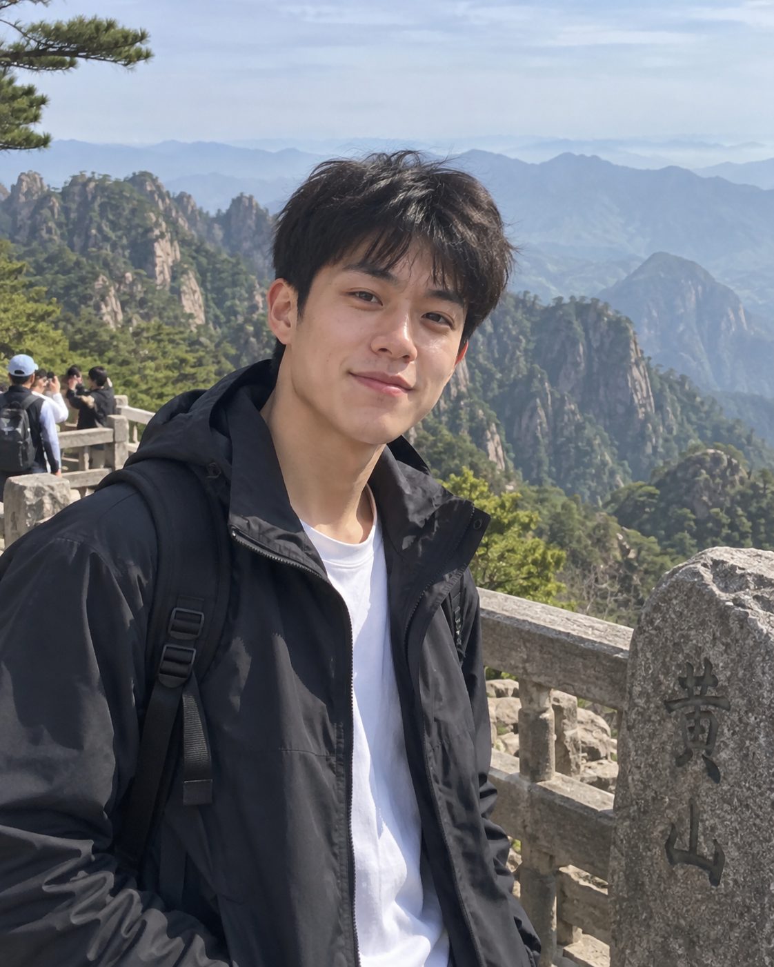 Young man taking a selfie at a Huangshan mountain viewpoint