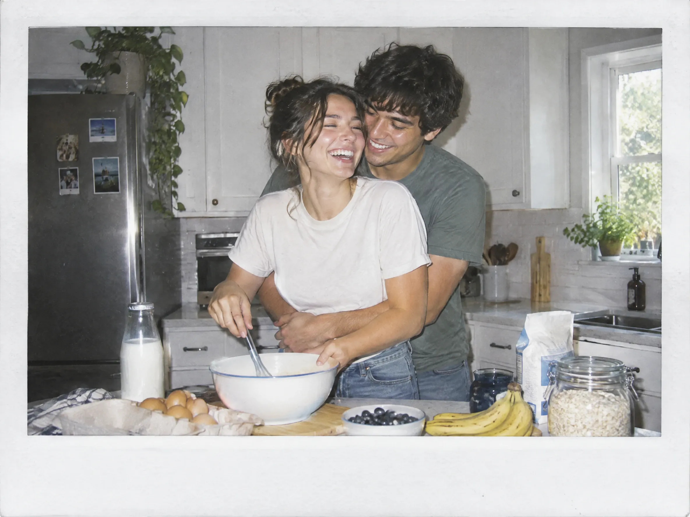 a polaroid-style photo shows a couple baking