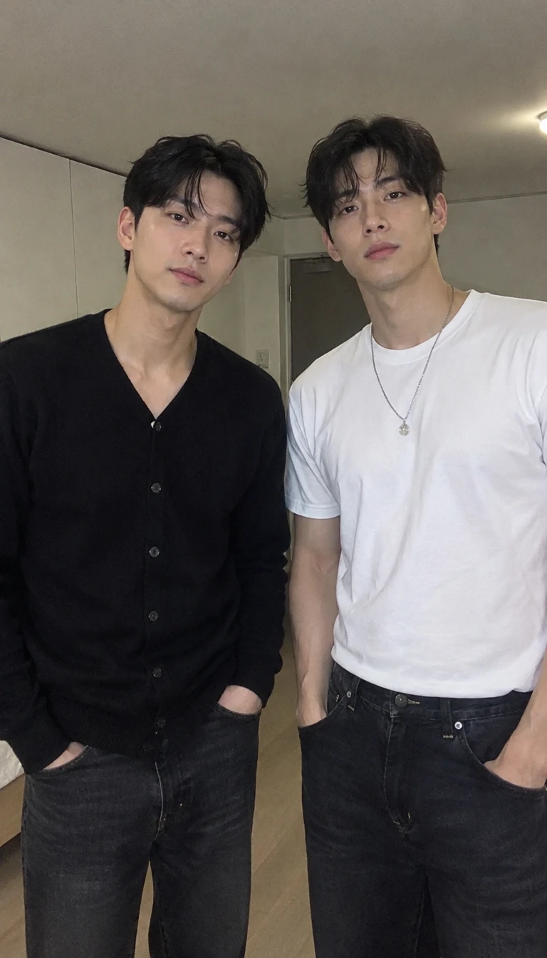 Two handsome young men posing in stylish casual outfits indoors.